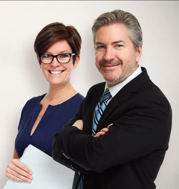 Two smiling legal professionals